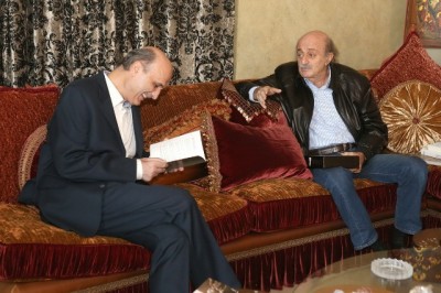 Progressive Socialist Party leader Walid Jumblatt  (R)  with Lebanese Forces chief Samir Geagea . They exchanged books as gifts