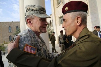 Iraq's army chief General Babakir Zebari (R) meets with U.S. Army General Martin Dempsey, chairman of the Joint Chiefs of Staff, at the defence ministry in Baghdad November 15, 2014. REUTERS/Stringer