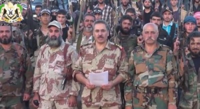 Colonel Abduall Rifai shown reading a statement  during the formation of a military faction in Qalamoun  near Damascus