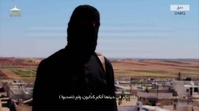 ISIS terrorist known as Jihadi John presenting the beheaded American captive, Peter Kassig.