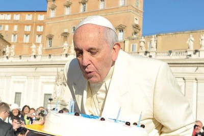 Pope Francis blows out candles on a cake for his 78th birthday in St. Peter's Square during his Wednesday general audience on Dec. 17, 2014. Credit: ANSA / L'OSSERVATORE ROMANO Pope Francis blows out candles on a cake for his 78th birthday in St. Peter's Square during his Wednesday general audience on Dec. 17, 2014. Credit: ANSA / L'OSSERVATORE ROMANO