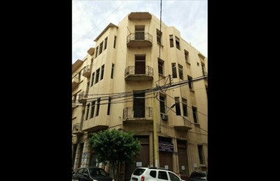 A photo of the historic Art Deco building being demolished in the Gemayzeh neighborhood of Beirut, Lebanon