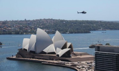 A police helicopter hovers over the Opera House after the building was evacuated. Photograph: ABC