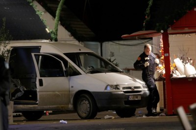 A member of the bomb squad searches a van which was driven into a crowd, injuring ten people, including five seriously wounded, according to French media, in Nantes December 22, 2014. (REUTERS/Stephane Mahe)