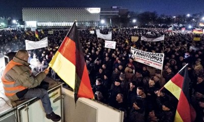 Pegida supporters, seen here in Dresden, include neo-Nazi elements as well as ordinary Germans with concerns about immigration. Photograph: Jens Meyer/AP