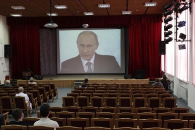 TV broadcast showing Russia’s President Vladimir Putin delivering his annual state of the union speech to members of parliament and other top officials in the Kremlin, in Stavropol, December 4, 2014. 