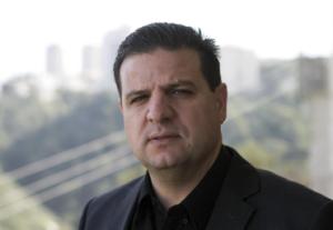 Ayman Odeh, 40, a first-time parliamentary candidate and the leader of the combined Arab list, from the communist Hadash party, poses in his house in the mixed Jewish-Arab city of Haifa, Israel, Monday, Jan. 26, 2015.   AP