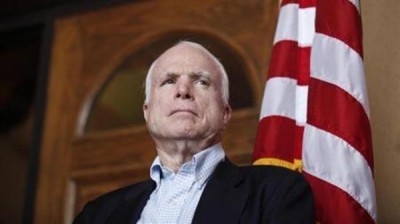 U.S. Senator McCain watches his colleagues speak during news conference following their tour of the Arizona-Mexico border in Nogales