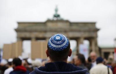 A man wearing a kippah waits for the start of an anti-Semitism demo at Berlin's Brandenburg Gate in September(Reuters)