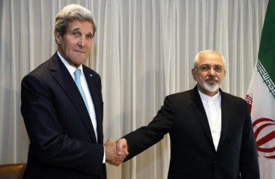 The pic that got the  Iranian FM in trouble.  U.S. Secretary of State John Kerry   with Iranian Foreign Minister Mohammad Javad Zarif before a meeting in Geneva January 14, 2015. CREDIT: REUTERS/RICK WILKING