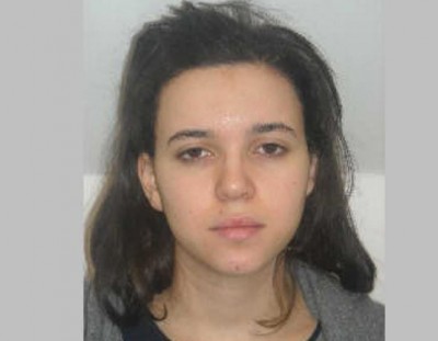 This photo provided by the Paris Police Prefecture Friday, Jan. 9, 2015 shows Hayat Boumedienne the suspect in the kosher market attack. Turkey's foreign minister said Monday Jan.12, 2015 that Boumedienne, wife of Amedy Coulibaly, one of the perpetrators of the terrorist rampage in France last week, crossed into Syria from Turkey on Jan. 8. The Islamic State group has put out publications claiming to have an interview with the widow of the gunman who attacked a kosher supermarket and a police officer, killing five people before he died in a raid by security forces.