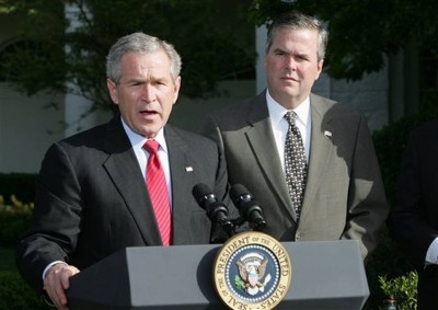 In this April 19, 2006 file photo, President George W. Bush, accompanied by his brother, then-Fla. Gov. Jeb Bush, speaks on the South Lawn at the White House in Washington. The question for Jeb Bush, as it had before and is sure to again, came during a meeting with prospective donors. At a table of Republican donors who helped pay for 2012 GOP presidential nominee Mitt Romney’s campaign, one wanted to know: How does the former Florida governor plan to distinguish himself from his brother, former President George W. Bush? RON EDMONDS,   AP PHOTO
