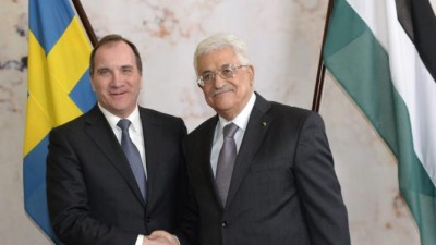 Sweden's Prime Minister Stefan Lofven (L) welcomes Palestinian President Mahmoud Abbas at the Rosenbad government headquarters in Stockholm February 10, 2015. Abbas will meet Sweden's new prime minister on Tuesday to further international support for his cause after the Nordic state infuriated Israel when it became the first major European country to recognise Palestine as a state