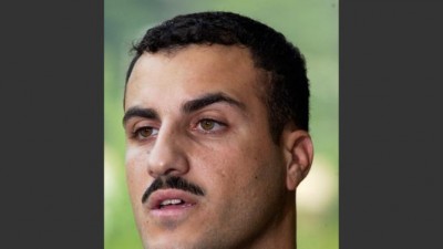 In this July 19, 2004 file photo, Marine Cpl. Wassef Ali Hassoun makes a statement to the press outside Quantico Marine Base in Quantico, Va. Hassoun's trial on desertion accusations starts Monday, Feb. 9, 2015 at Camp Lejeune, N.C. (AP Photo/Steve Helber, File)