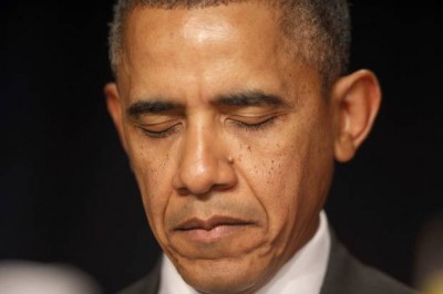 President Barack Obama closed his eyes as a prayer was offered at the National Prayer Breakfast in Washington on Thursday morning.