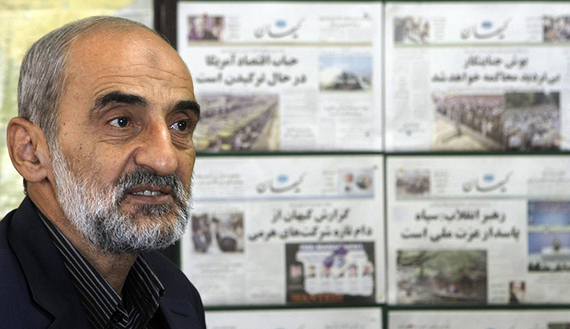 Hossein Shariatmadari, editor-in-chief of the hard-line Kayhan newspaper group for more than two decades, sits next to issues of the newspaper at his office in Tehran, Sept. 16, 2007.  (photo by Getty Images/Behrouz Mehri) Read more: http://www.al-monitor.com/pulse/originals/2015/06/iran-us-nuclear-deal-great-satan.html#ixzz3iya73sGQ