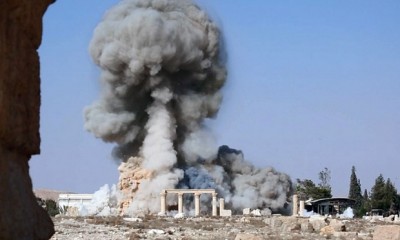 A photograph released on 25 August 2015 on a social media site used by Isis militants showing smoke from the destruction of the 2,000-year-old Temple of Baalshamin in Palmyra. Photograph: Uncredited/AP