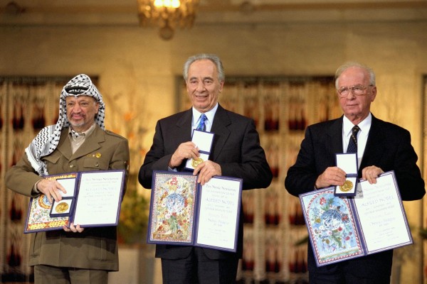 Yitzhak Rabin (R) , Shimon Peres (C) and Yasser Arafat receiving the Nobel Peace Prize following the Oslo Accords.