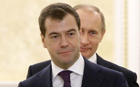 File photo of Russian Prime Minister Dmitry Medvedev ( front) and President Vladimir Putin