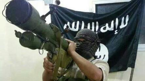 An Islamic State fighter is shown with man-portable air defense systems, or MANPADS, guided anti-tank missile. 