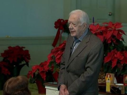 Former US President Jimmy Carter stands before a full sanctuary at Maranatha Baptist Church in Plains, Ga. to deliver tragic news ahead of his Sunday school class. (Photo: WXIA-TV, Atlanta)