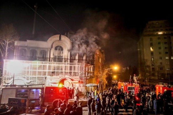 Smoke rises as Iranian protesters set fire to the Saudi embassy in Tehran, Sunday, Jan. 3, 2016. Protesters upset over the execution of a Shiite cleric in Saudi Arabia set fires to the Saudi embassy in Tehran. (Mohammadreza Nadimi/ISNA via AP)