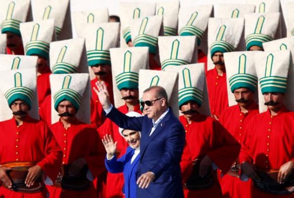 Turkish President Tayyip Erdogan, accompanied by his wife Emine Erdogan, greets supporters during a rally to mark the 563rd anniversary of the conquest of the city by Ottoman Turks, in Istanbul, Turkey, May 29, 2016. REUTERS/Murad Sezer