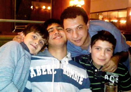 This undated handout image provided by the friend of Nizar Zakka Inc., shows, Zakka, a Lebanese technology expert and advocate for Internet freedom, second right, posing with his relatives at an unidentified location. Zakka, was arrested in Tehran in September 2015 after being invited by the Iranian government to attend a conference there. (Friends Nizar Zakka Inc. via AP) MANDATORY CREDIT