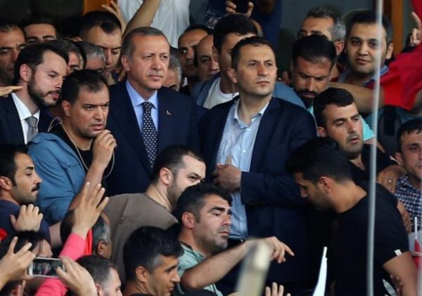 Turkish President Tayyip Erdogan is seen amid his supporters at the Ataturk Airport in Istanbul, Turkey July 16, 2016. REUTERS/Huseyin Aldemir