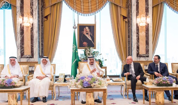 In this photo courtesy of Dalati and Nohra , King Salman of Saudi Arabia ( C) is shown with Lebanese PM Tammam Salam (2d R  ) and Former PM Saad Hariri (R) 