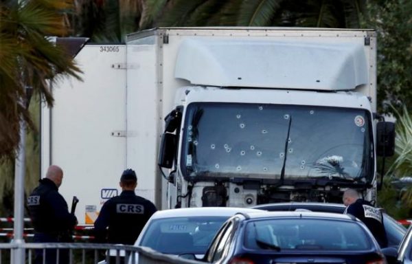 French CRS and judicial police work near the heavy truck that ran into a crowd at high speed celebrating the Bastille Day July 14 national holiday on the Promenade des Anglais killing 84 people in Nice, France, July 15, 2016.    REUTERS/Eric Gaillard