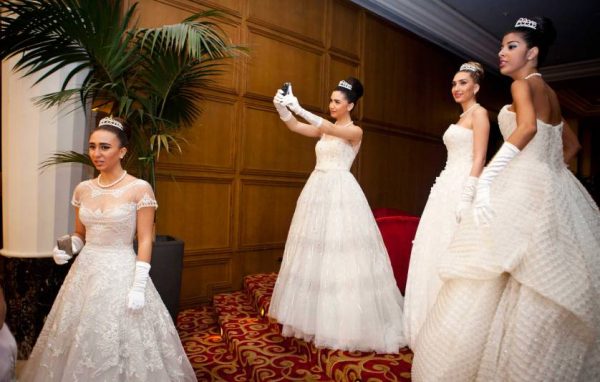 02/11/2013 JOUNIEH, LEBANON Taline Mansour, (center) poses for a self portait on her mobile phone, while amongst Debutante Ball participants, before the Ball at Casino du Liban where the Ball is held.