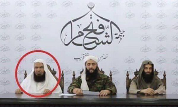 Al-Masri (left) with al-Nusra leader Abu Mohamad al-Jolani (centre)