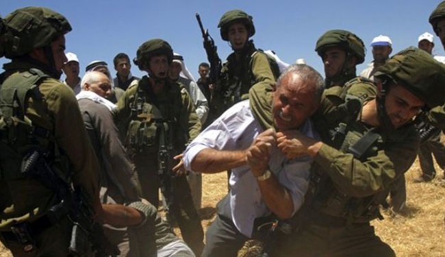 An Israeli soldier scuffles with a Palestinian man in the occupied West Bank. (file photo)