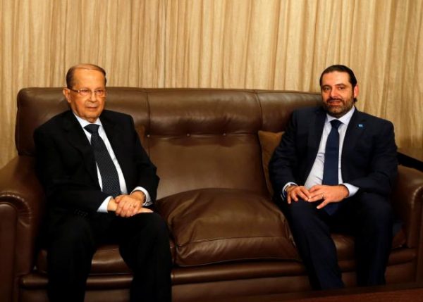  FPM founder Michel Aoun (L) sits next to Lebanon's former prime minister Saad al-Hariri after he said he will back Aoun to become president in Beirut, Lebanon October 20, 2016. REUTERS/Mohamed Azakir