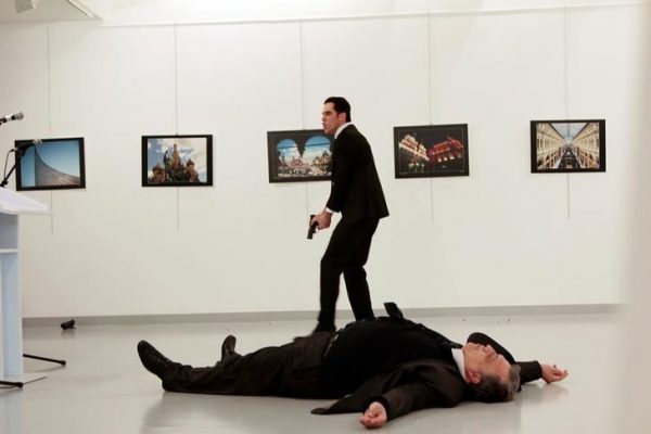 Russian Ambassador to Turkey Andrei Karlov lies on the ground after he was shot by Mevlut Mert Altintas at an art gallery in Ankara, Turkey, December 19, 2016. Hasim Kilic/Hurriyet via REUTERS