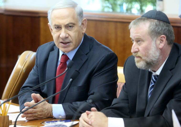 Israel's attorney-general Avichai Mandelblit is shown with Prime Minister Benjamin Netanyahu