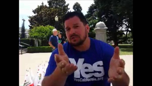 Marcus Ruiz Evans of The Yes California Independence Campaign, talks to passersby about California succeeding from the United States and becoming its own nation, Wednesday, Nov. 9, 2016, in Sacramento, Calif., . Support for the proposal grew on social media following Tuesday’s election of Republican Donald Trump. AP Photo/Rich Pedroncelli/File