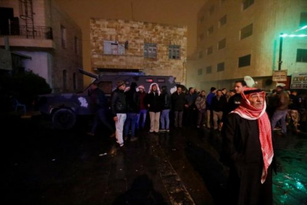 People follow the security operations in the vicinity of Kerak Castle where armed gunmen carried out an attack, in the city of Karak, Jordan, December 18, 2016.REUTERS/Muhammad Hamed