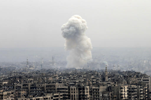Smoke rises following a Syrian government air strike on rebel positions, in eastern Aleppo, Syria, Monday, Dec. 5, 2016. The government seized large swaths of the Aleppo enclave under rebel control since 2012 in the offensive that began last week. The fighting was most intense Monday near the dividing line between east and west Aleppo as government and allied troops push their way from the eastern flank, reaching within less than a kilometer, about half a mile, from the citadel that anchors the center of the city. (AP Photo/Hassan Ammar)