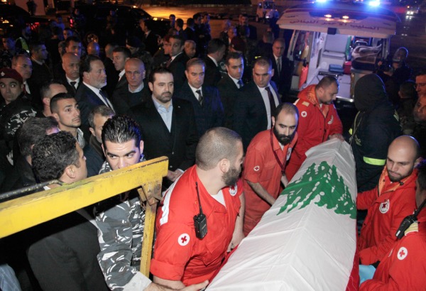 The Red Cross is shown carrying  the coffin of one of the Lebanese victims of the Istanbul attack