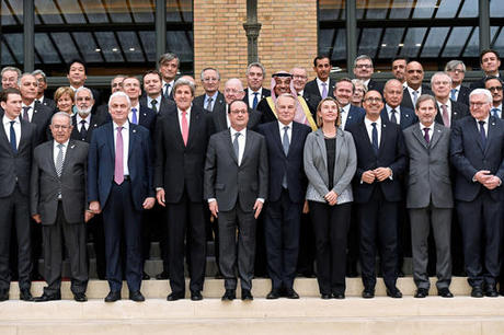 (From L) Austrian Foreign Affairs minister Sebastian Kurz, Algerian Foreign minister Ramtane Lamamra, Russian Ambassador to France Alexander Orlov, US Secretary of State John Kerry, French President Francois Hollande, French Foreign Minister Jean-Marc Ayrault, European Union Foreign Policy Chief Federica Mogherini, French State Secretary for European Affairs Harlem Desir, European Union Commissioner Johannes Hahn and German Foreign Minister Frank-Walter Steinmeier pose for a group photo during a Mideast peace conference in Paris, Sunday, Jan. 15, 2017. Fearing a new eruption of violence in the Middle East, more than 70 world diplomats gathered in Paris on Sunday to push for renewed peace talks that would lead to a Palestinian state. (Bertrand Guay/Pool Photo via AP)