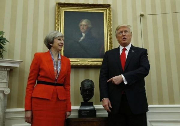 U.S. President Donald Trump points to British Prime Minister Theresa May in the White House Oval Office in Washington, U.S., January 27, 2017. REUTERS/Kevin Lamarque