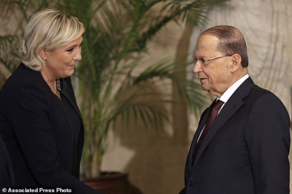 Lebanese President Michel Aoun, right, speaks with French far-right and presidential candidate Marine Le Pen, at the presidential palace, in Baabda east Beirut, Lebanon, Monday, Feb. 20, 2017. Le Pen, head of the anti-immigration National Front, said their two countries should be "pillars" in organizing the fight against Islamic fundamentalism. Le Pen on Monday said Syrian President Bashar Assad is the lesser evil . (AP Photo/Hussein Malla)