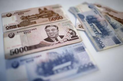 A portrait of the late Kim Il Sung is seen on the 5,000 bill of the North Korean won, Monday, Feb. 6, 2017. While foreign brand-name goods are often paid for in the U.S. dollars, Euros or Chinese yuan, and priced accordingly at the official exchange rate, most people buy their daily necessities in North Korea's own currency, the won, which has an unofficial and more market-friendly exchange rate. (AP Photo/Wong Maye-E)