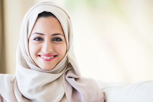 A middle eastern woman wearing a headscarf