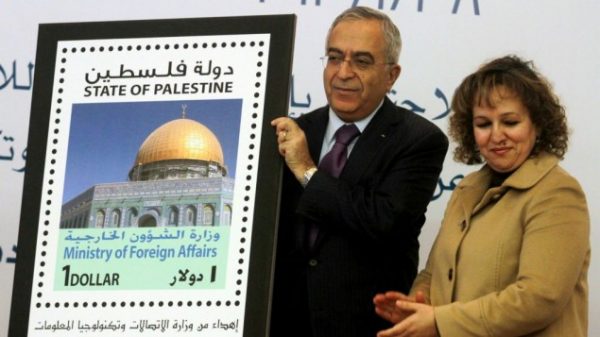 Former Palestinian prime minister Salam Fayyad participated in the unveiling of the first postage stamp bearing the name of the State of Palestine on January 28, 2013. (photo credit: Issam Rimawi/Flash90)
