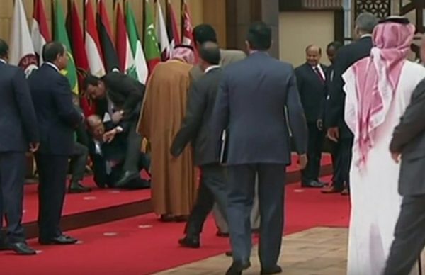 President Michel Aoun is being helped   after falling over at the Arab Summit in Amman. March 29, 2017. 