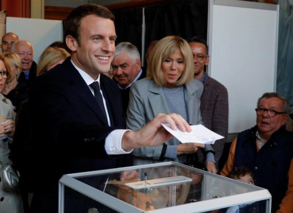 Smiling favourite Emmanuel Macron casts ballot at a polling station in Le Touquet, northern France