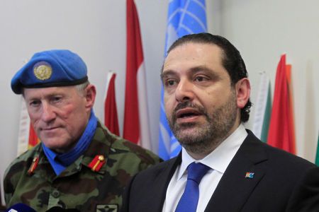 Lebanese Prime Minister Saad al-Hariri speaks during a news conference as UNIFIL Head of Mission and Force Commander Major-General Michael Beary (L) listens at the United Nations Interim Force in Lebanon (UNIFIL) headquarters in Naqoura, near the Lebanese-Israeli border, southern Lebanon April 21, 2017. REUTERS/Ali Hashisho